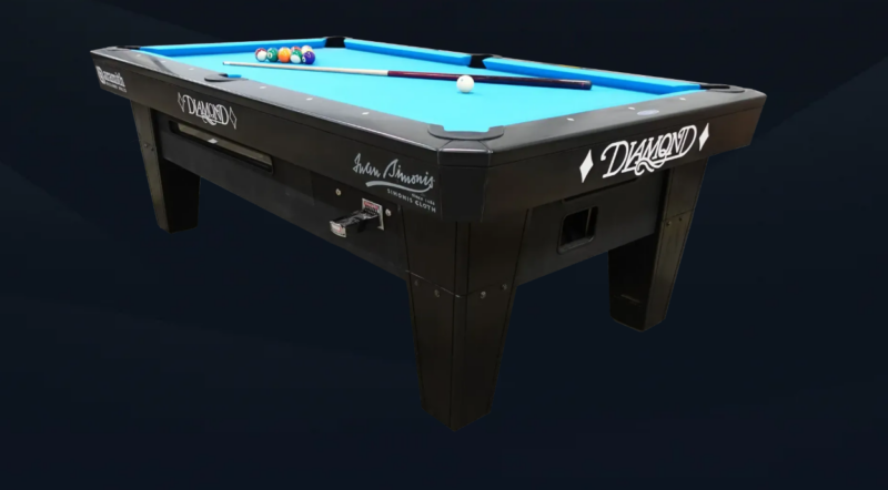 Diamond pool table with blue cloth, billiard balls, and a cue